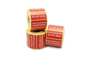 Photographs Do Not Bend Labels, White Text, Red Labels. Permanent adhesive.