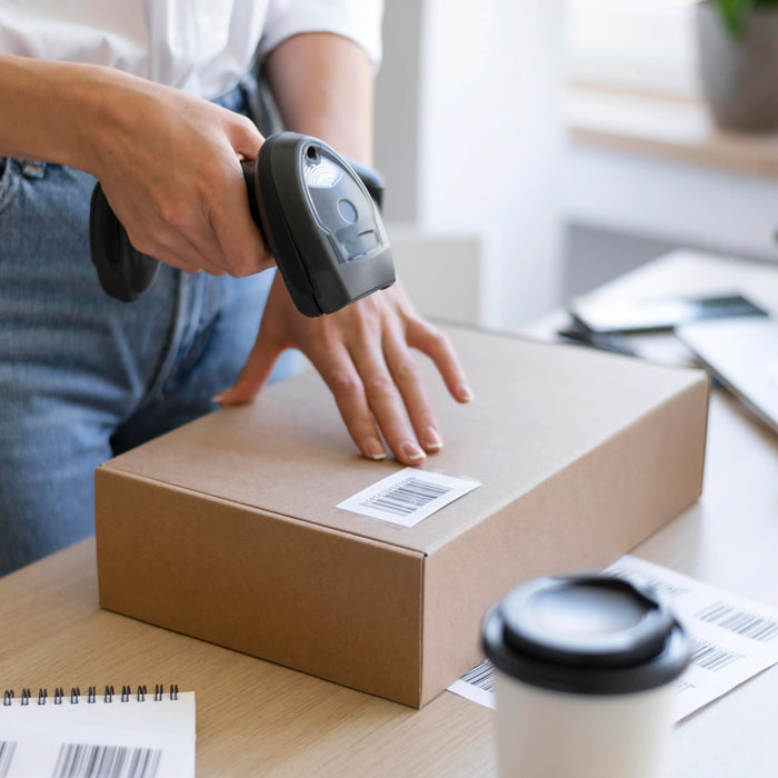 Woman Scanning Direct Thermal Label in office